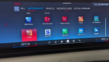 The dashboard of a BMW X3 M50 showing multimedia source icons