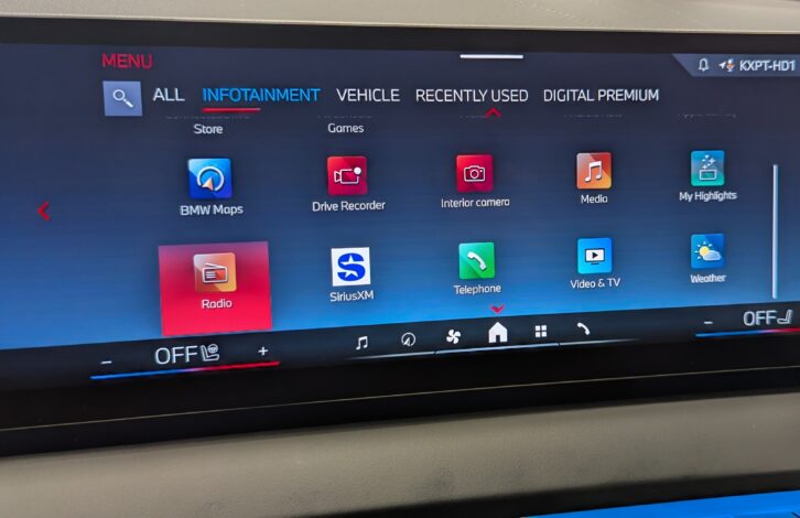 The dashboard of a BMW X3 M50 showing multimedia source icons