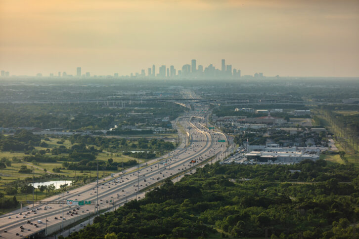 Aerial Shot of Multiple Lane Highway with Houston Skyline in the Distance