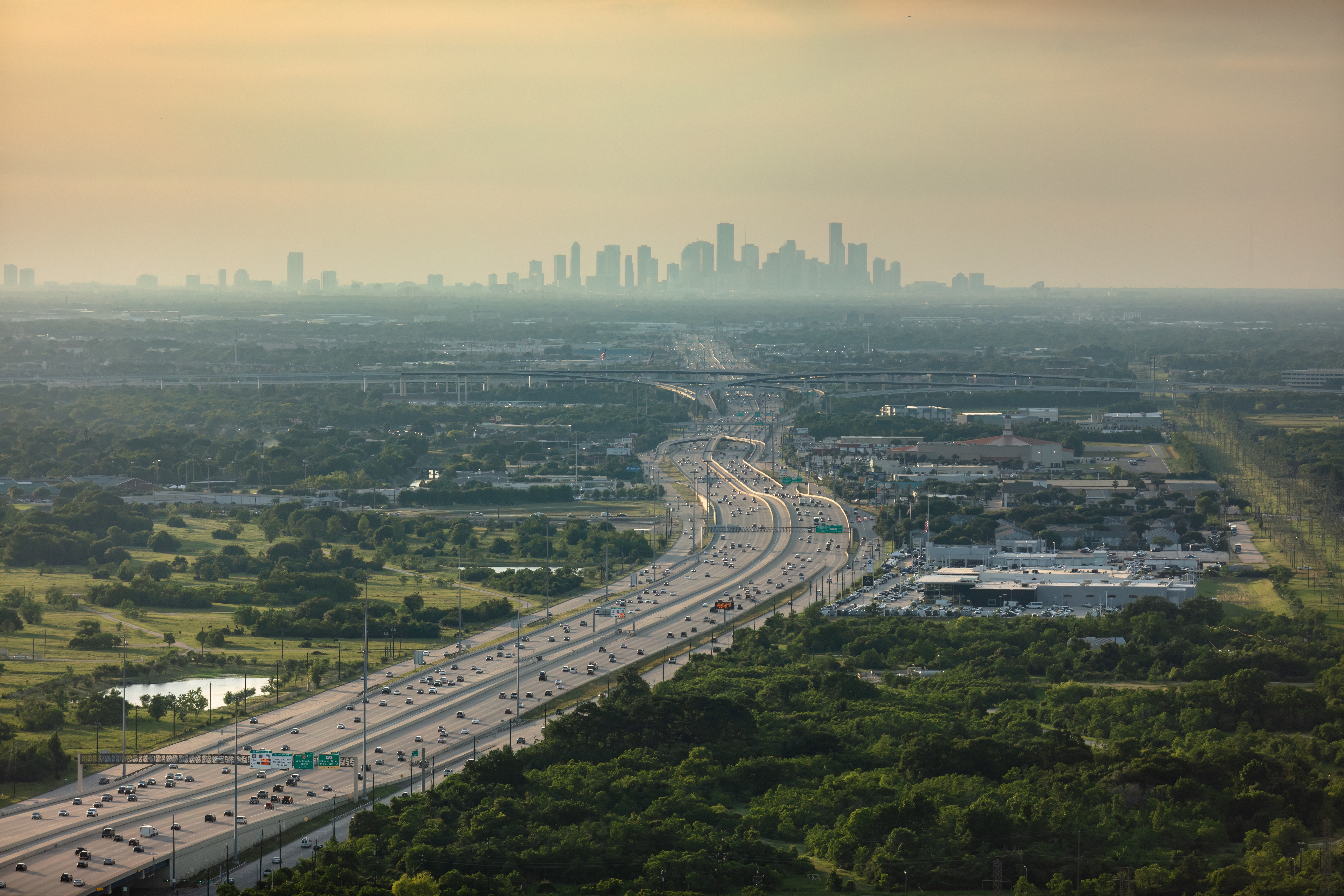 Aerial Shot of Multiple Lane Highway with Houston Skyline in the Distance