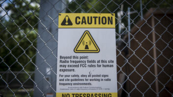 A sign cautions the presence of radio frequency fields in excess of the Federal Communications Commission (FCC) rules for human exposure at a data transmission tower in Chicago, Illinois, U.S Photographer: Christopher Dilts/Bloomberg via Getty Images