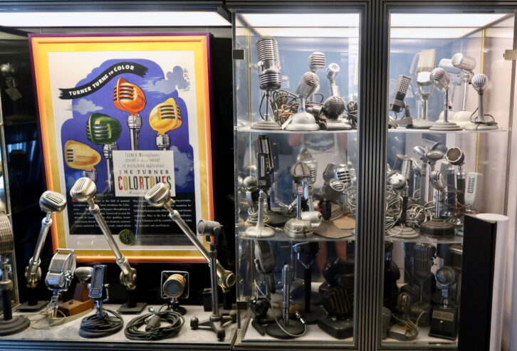 Geoffrey Hacker's glass-enclosed mic collection.