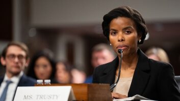 FCC Commissioner Olivia Trusty sits at a table during a Senate hearing in December 2025