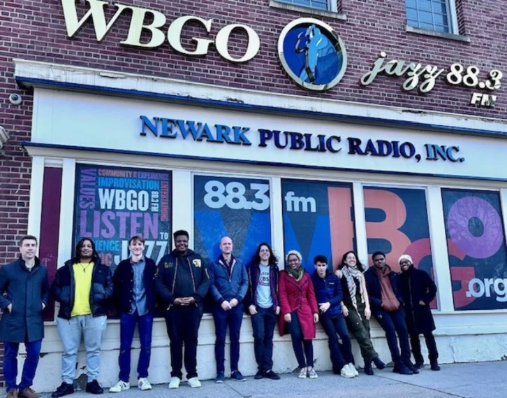 A large jazz ensemble from the Borough of Manhattan Community College in front of WBGO's Newark, N.J., studios in 2024.