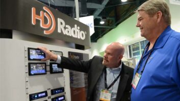Jeff Detweiler discusses Xperi’s HD Radio technology with Kyle Wesley of Radio Disney at an NAB Show.