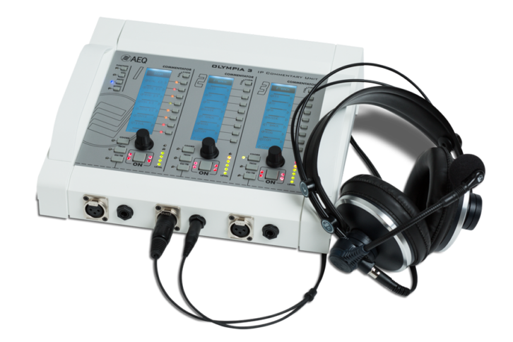 An Olympia 3 commentary system device with headphones attached