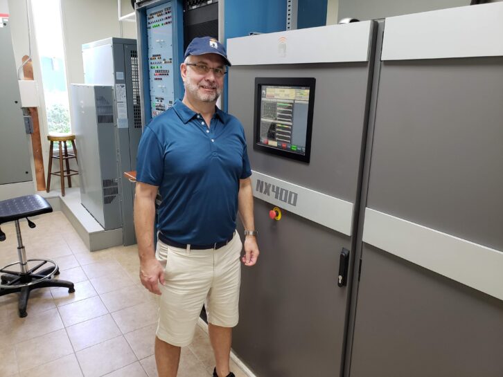 Rodgers with the Nautel NX400 transmitter used by Trans World Radio on Bonaire.