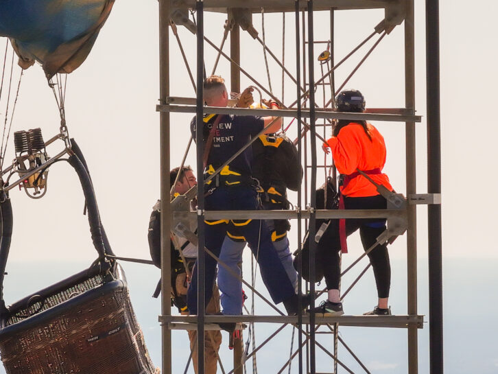 Approximately 14 members of the Longview Fire Department climbed the nearly 1,100-foot tower to rescue the two balloonists. Credit: Longview Fire Department