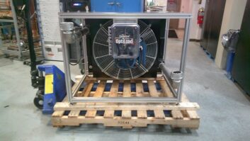 The Dielectric heat exchanger hardware is shown sitting on a pallet in a warehouse