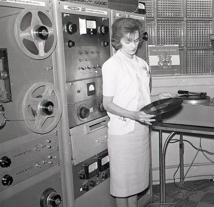 An IGM 200 “Simplimation” system is visible behind the woman holding an LP. This is at WDOD in Chattanooga, Tenn. in the early 1960s.