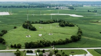 An aerial view of the four-tower transmitter site in Dupo, Ill., acquired by the Lutheran Church—Missouri Synod. Originally functioning as KXFN's nighttime-only site, it now serves as the consolidated, diplexed home for both KFUO and KXFN.