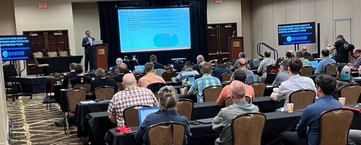 Attendees at a previous PREC event listen to a speaker.