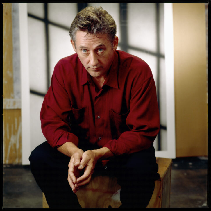 Portrait of American Artist Edward Ruscha wears a red collared shirt and stares at camera in Los Angeles in 1985. (Photo by Bonnie Schiffman/Getty Images)