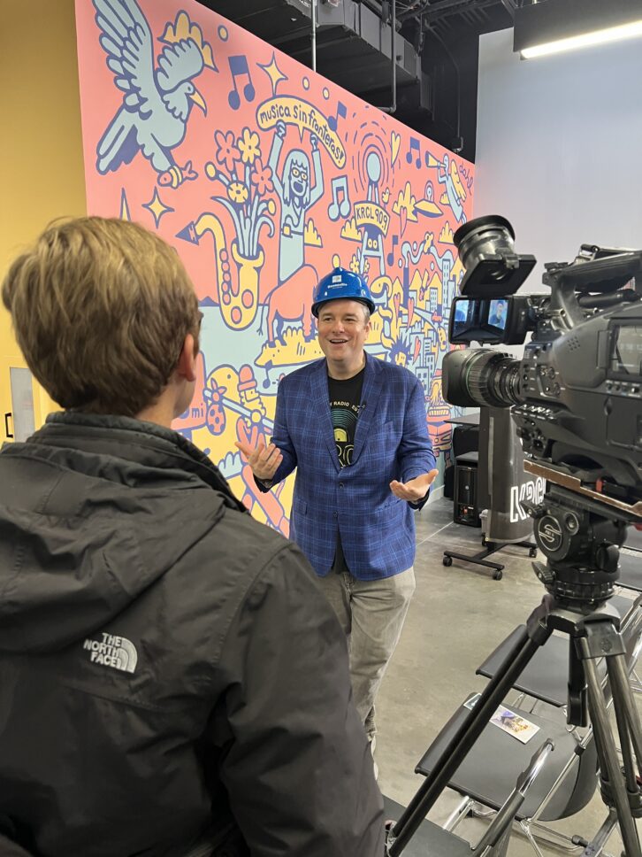 KRCL executive director Gavin Dahl speaks to a local TV reporter about the stations' Next Generation capital campaign on April 2. Credit: Lara Jones