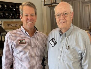 John Foster stands with Georgia Governor Brian Kemp