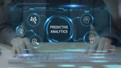 The words "Predictive Analytics" are presented in an abstract setting that suggests technology, with icons near it that suggest search, business, revenue and technology parameters