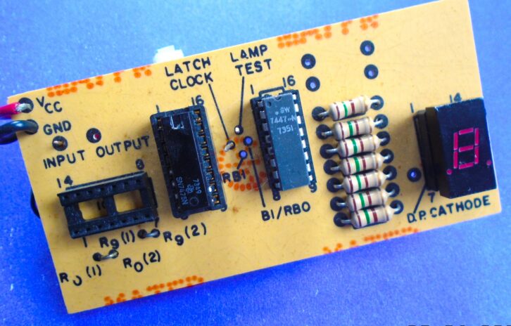 A useful shop item, a seven-segment diode tester. The seven resistors limit the current to each of the segments.
