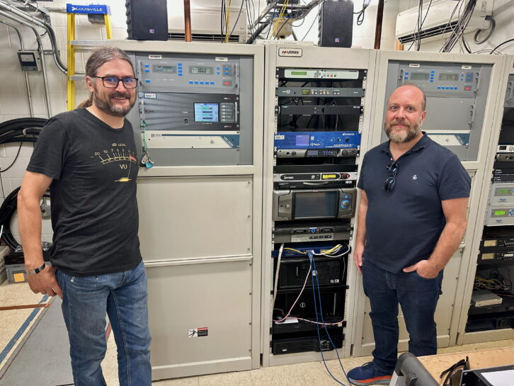 WXPN Assistant Engineer Zach Maupin, left, and Director of Engineering Jared Styles, with WXPN’s equipment rack inside the Gross Tower transmitter building at Roxborough. Its Harris Z8HD transmitter was installed in 2007.