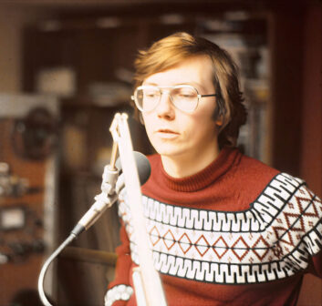 A photo of a yhoung Don Backus in a radio production room
