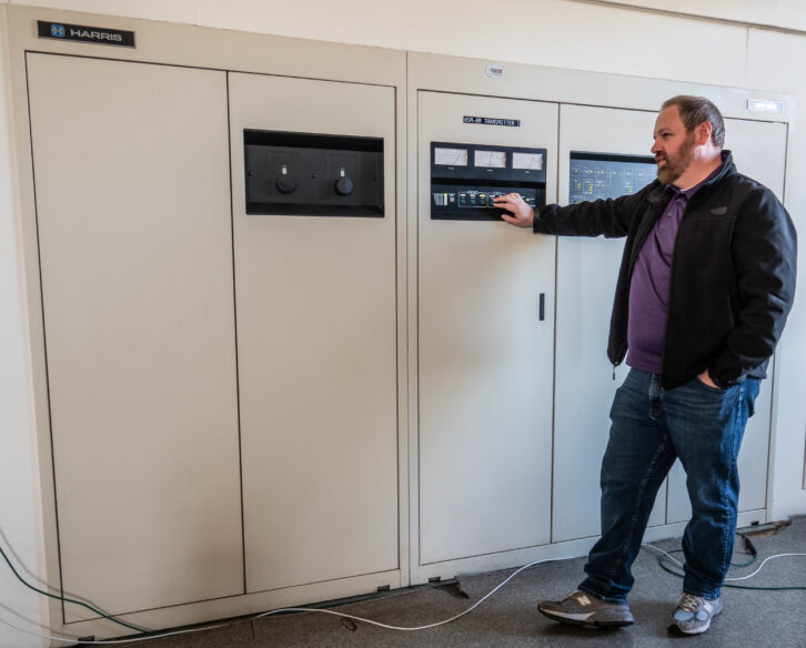 Fig. 14 Jason Cooper at the Harris DX-50 transmitter.