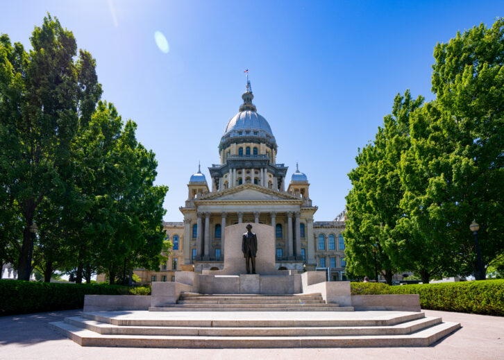 General views of the Illinois State Capitol Building, featuring a statue of Abraham Lincoln at the steps leading to the entrance of the capitol on May 11, 2026 in Springfield, Illinois.