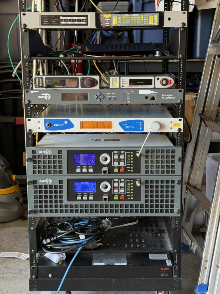 A test equipment rack established near Sacramento, California, features the 2wcom MPX-2c IP codec (center, blue faceplate) coupled with two GatesAir Flexiva transmitters to evaluate the unified multi-protocol encapsulation delivery method.