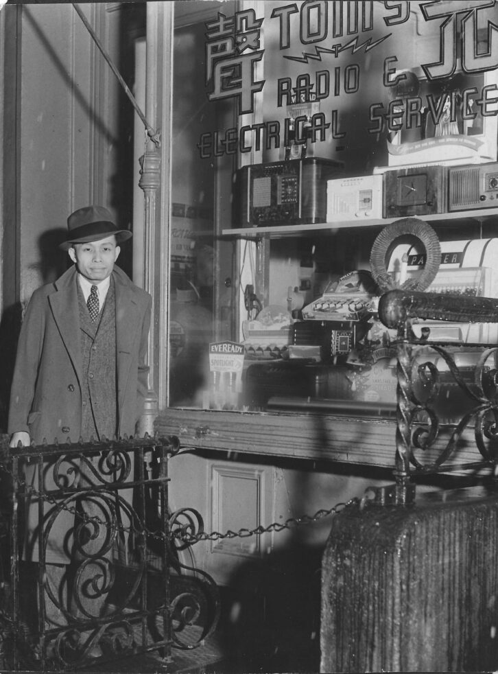 Wei outside the radio repair shop. Credit: Damon Wei