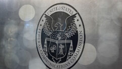 The seal of the Federal Communications Commission on an office door. (Al Drago/Bloomberg via Getty Images)