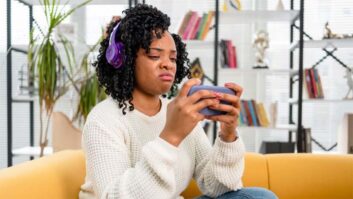 Frustrated listener wearing headphones