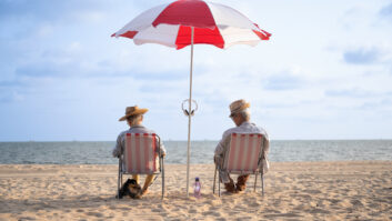 retirement couple travel on the beach
