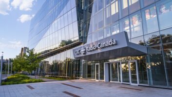 The entrance to an office building with a sign above the door for CBC/Radio-Canada
