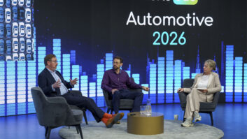 Author Nick Piggott, left, talks with Gregor Pötzsch and Jacqueline Bierhorst at WorldDAB Automotive 2026.