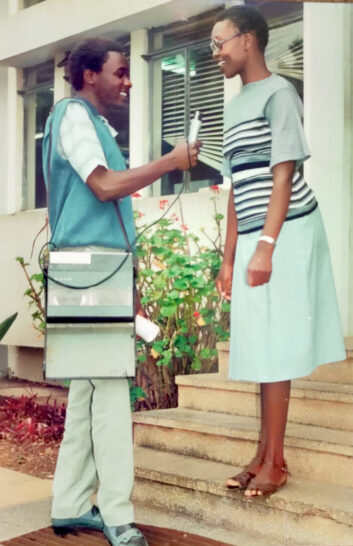 Toepista Nabusoba’s colleague Patrick Rukwaro interviewing her with a Sony recorder
