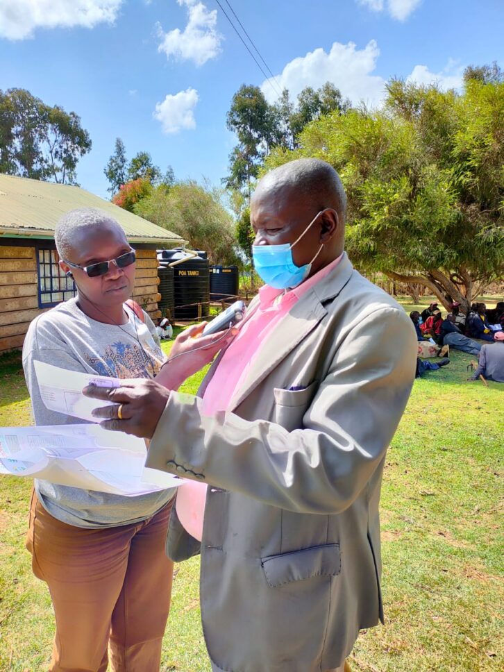 Toepista Nabusoba interview’s a farmer in the field. Note the small recorder.