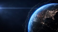 Image of the Earth modified to depict a satellte network hovering above it