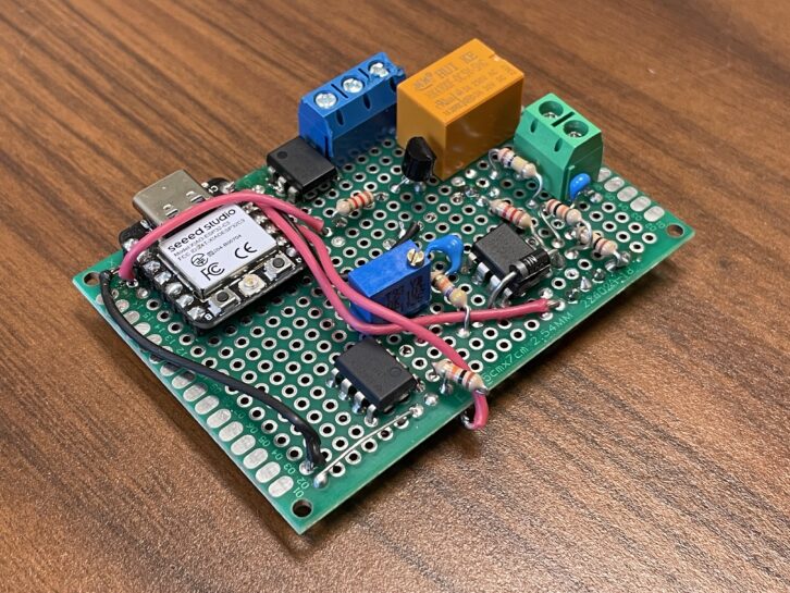 A small electronics circuit board with components mounted.