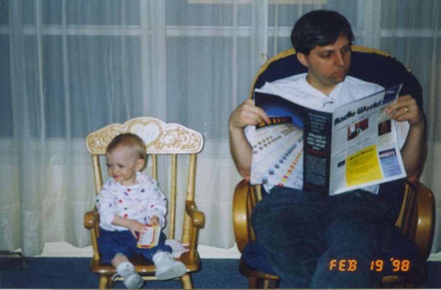 Daughter Katie, left, while Jeff reads a certain industry trade publication, in 1998.