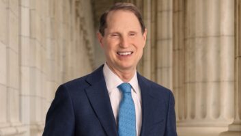 Headshot of Senator Ron Wyden standing in front of classical columns