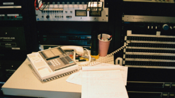 The "earpiece hack" setup at WNYC's Kearny, N.J., transmitter facility on Sept. 11. An unscrewed telephone earpiece was wired directly into the audio processor patch panel to get AM 820 back on the air overnight.