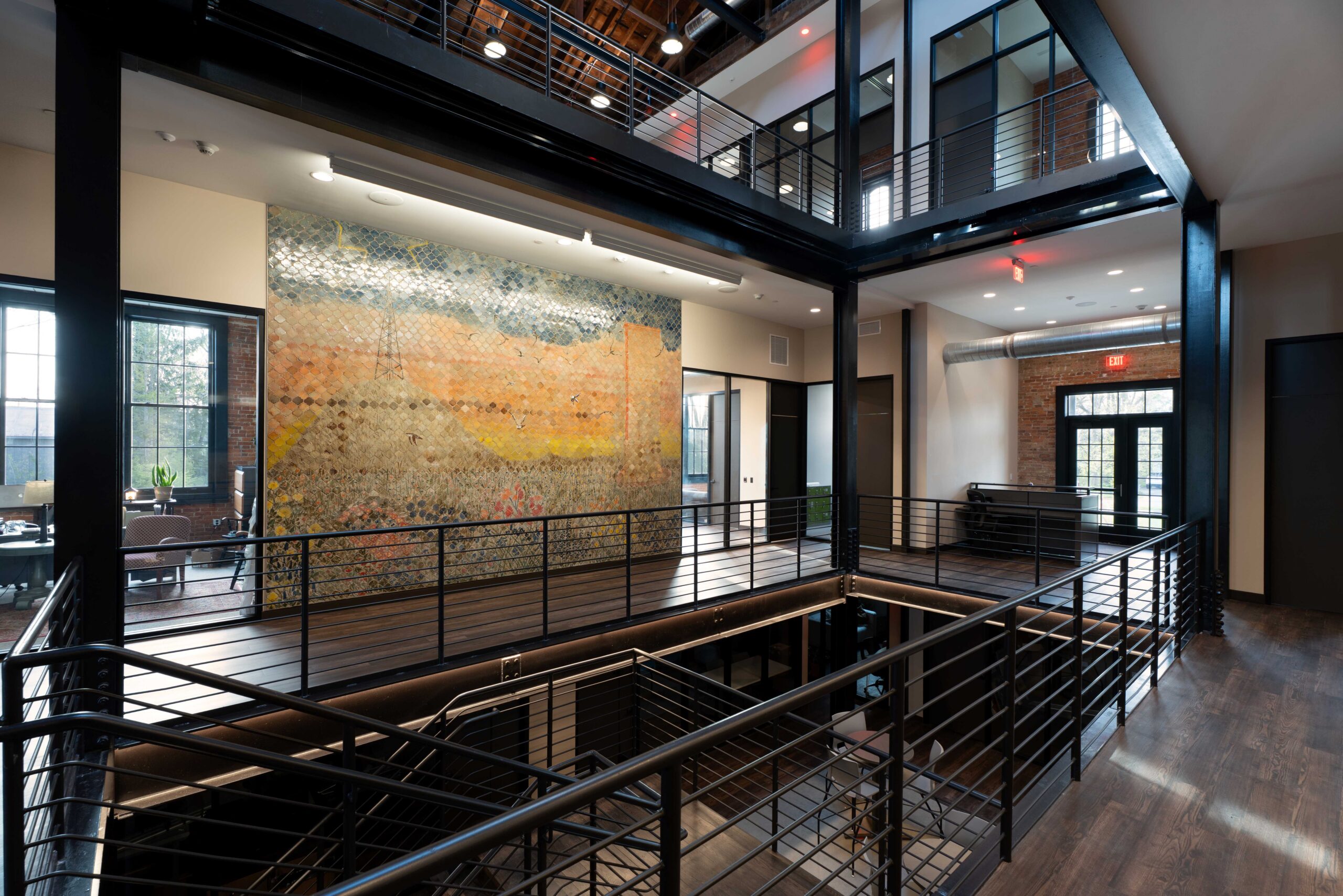 The Donald Heinrich Main Lobby & Atrium, a three-story space blending old and new, features a large, striking ceramic mural by Naysan McIlhargey.credit: Ruthie Herman 