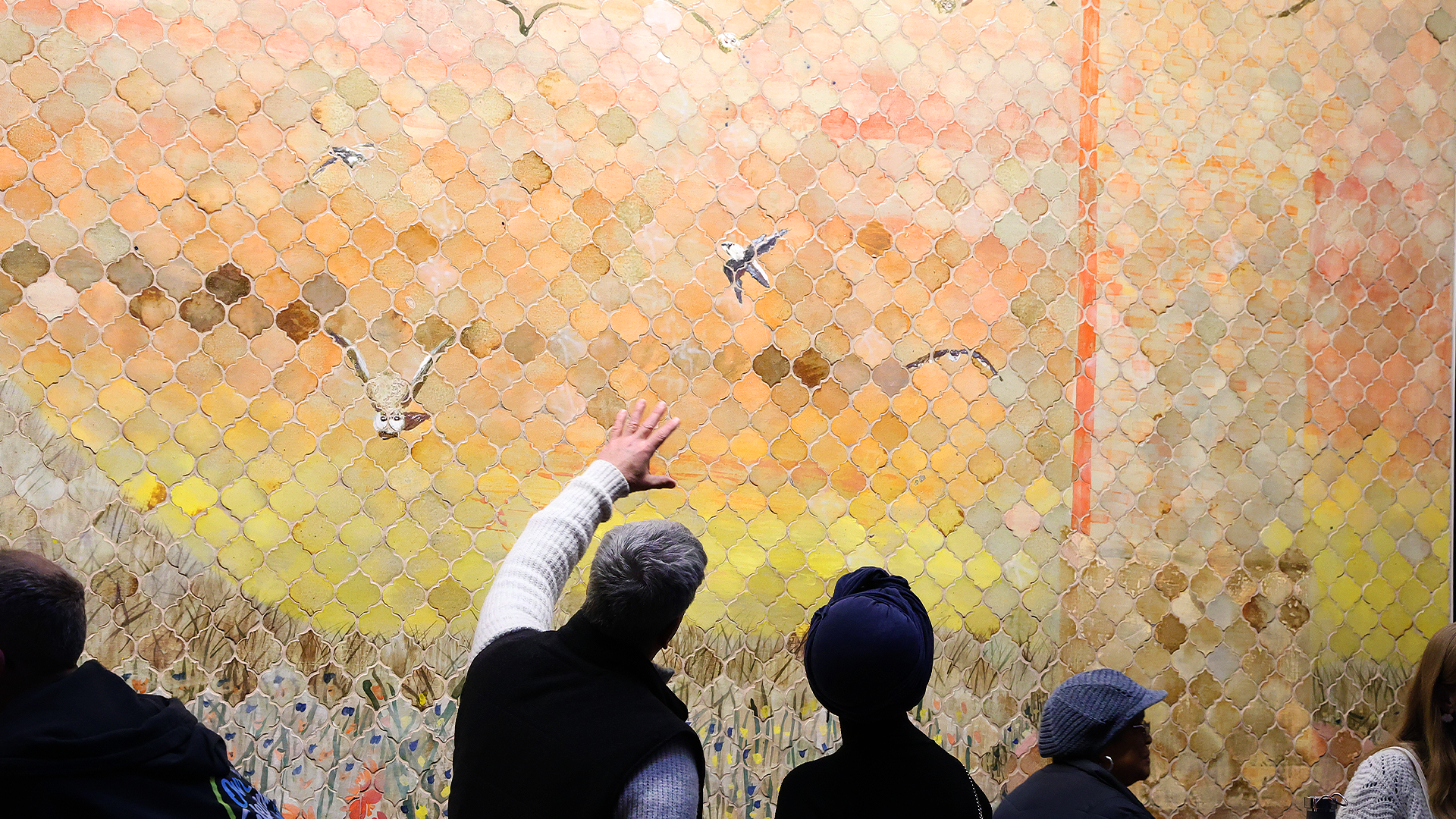 The lobby mural by Naysan McIlhargey references chimney swifts that live on the property as well as the station’s broadcast tower.credit: Ben Guenther for WYSO 