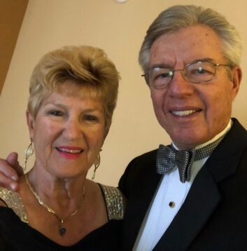 Sandra and Terry Shockley smile for the camera, dressed for a formal event