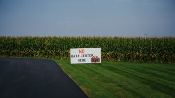 A 'No Data Center Here' sign at a cornfield near the proposed QTS data center site on the outskirts of Clinton, Iowa, on Wednesday, Sept. 2, 2026. Blackstone Inc.-owned QTS has a solution for the economic deficit of Clinton, Iowa: a massive data center that would bring thousands of construction jobs and provide nearly $200 million in property taxes in its first 10 years, a transformative sum for a place with a $25 million operating budget. Photographer: Jamie Kelter Davis/Bloomberg via Getty Images