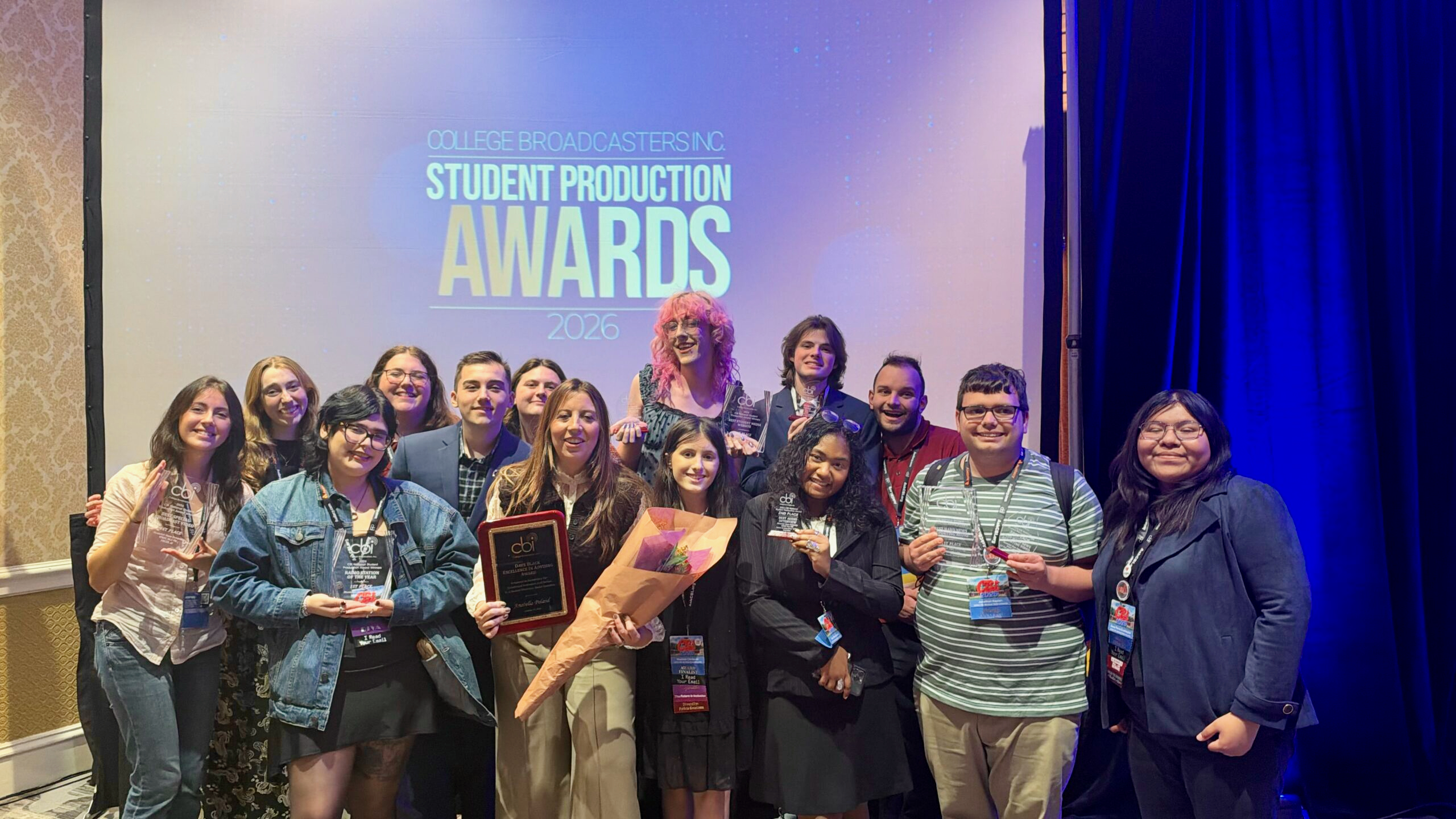 Students from WMSC(FM) at Montclair State University, with General Manager Anabella Poland, celebrate wins at the National Student Production Awards.