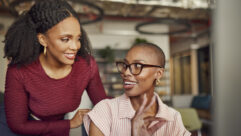 Women, collaboration and okay sign at computer for planning, success and discussion of positive feedback in office. Happy business people smiling at desktop for agreement, approval or yes to strategy