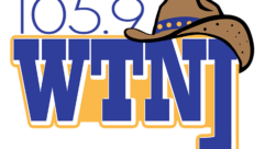 Logo of WTNJ radio station, blue letters with a cowboy hat