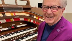 bob Heil sits at an organ keyboard